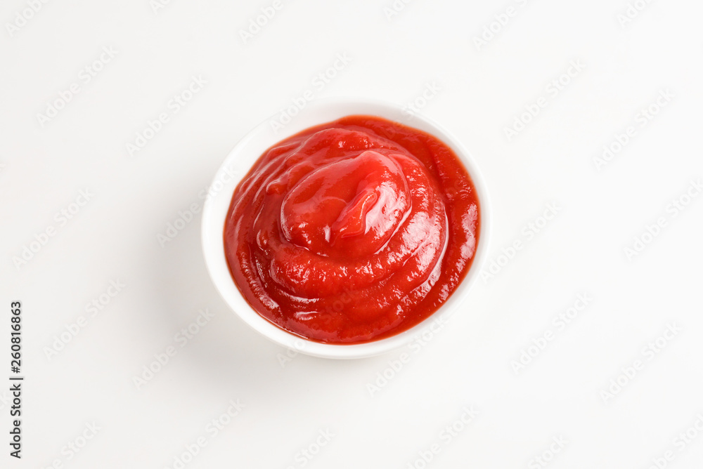 Ketchup in white plate on white background. Ketchup in white plate on white background.