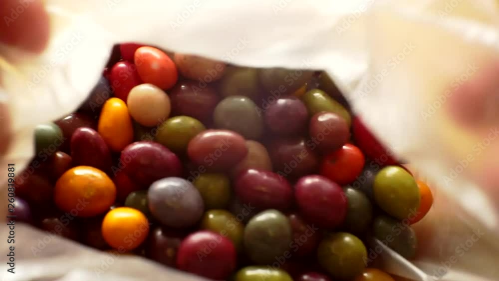 chocolates covered with colored glaze.close-up.moving sweets background. chocolates covered with colored glaze.close-up.moving sweets background.
