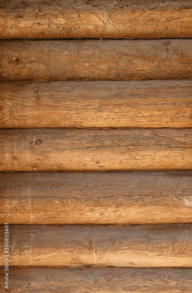 Blockhouse background. Big old timber wall. Retro wooden surface. Horizontal structure. Summer day. Blockhouse background. Big old timber wall. Retro wooden surface. Horizontal structure. Summer day.