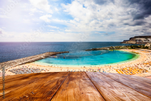 desk of free space and summer beach background 