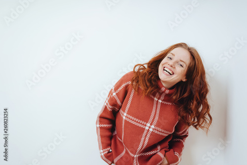 Happy cheerful young woman in a red sweater