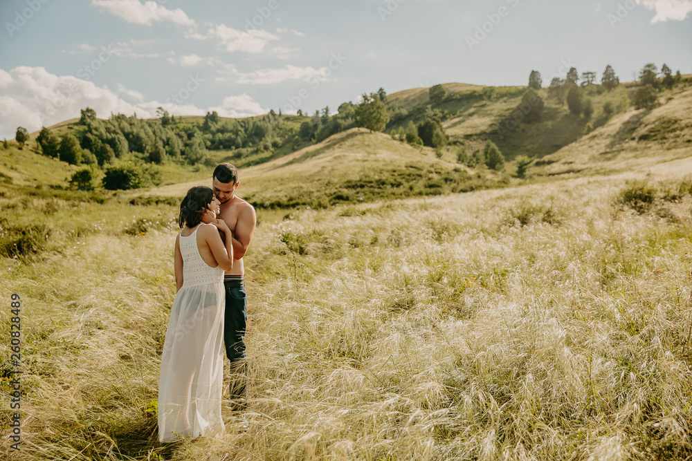 lifestyle . Man and a woman together outdoor. Kiss on the nature. lifestyle . Man and a woman together outdoor. Kiss on the nature.