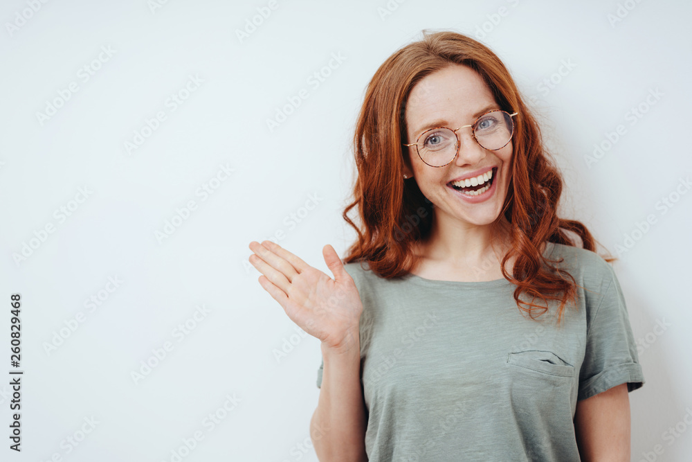 Cute young woman pointing to copyspace Cute young woman pointing to copyspace