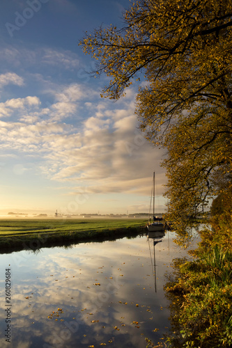 Autumn trees along a canal photo