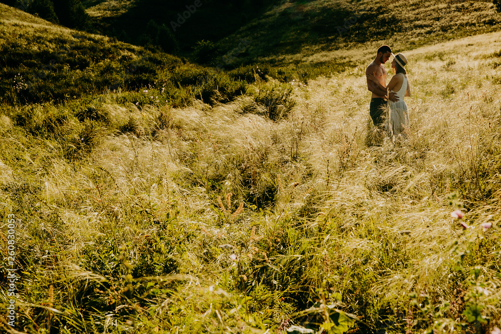 Naklejka premium Love Couple in love romantic road summer field happy. Russia. lake aslykul