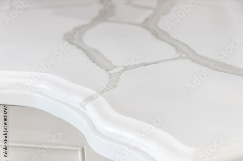 Closeup of a marble looking quartz countertop edge profile with beautiful natural calacatta stone veining photo