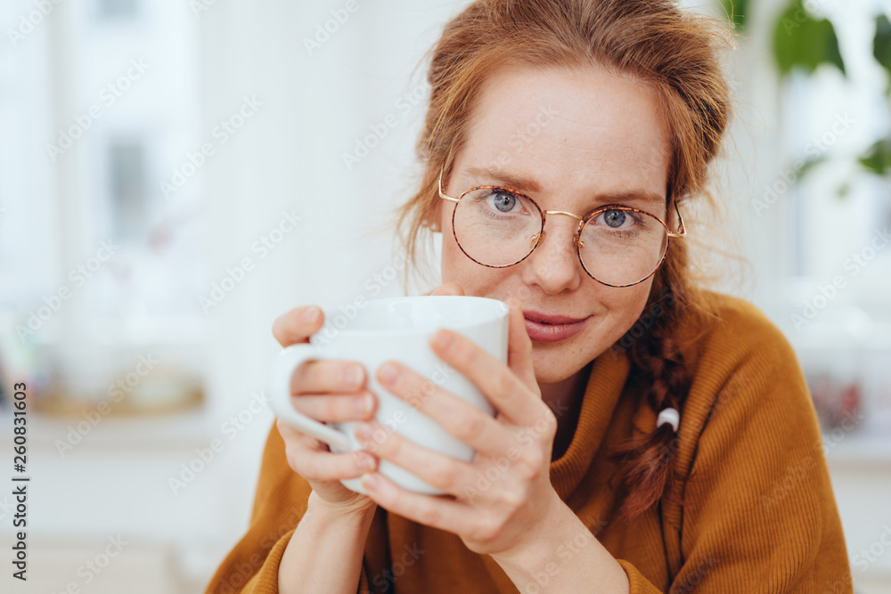 Sincere interested young woman staring at camera Sincere interested young woman staring at camera