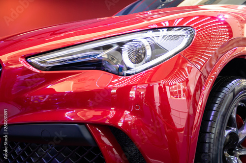Headlight of red modern car with LED light
