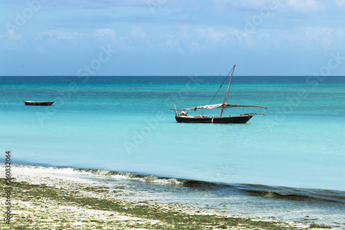 Wooden boats on turquoise water in Zanzibar