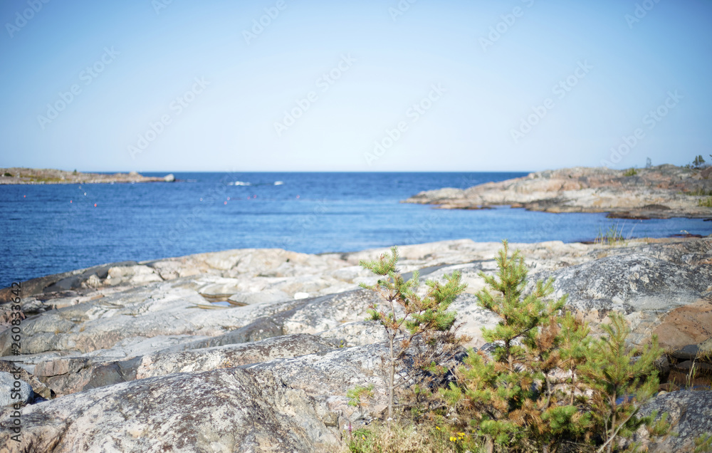 Swedish archipelago during summer. Cliffs, sea and distant islands