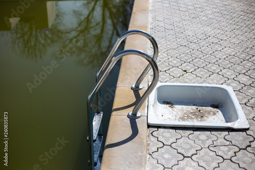 Abandoned pool in sunny day.