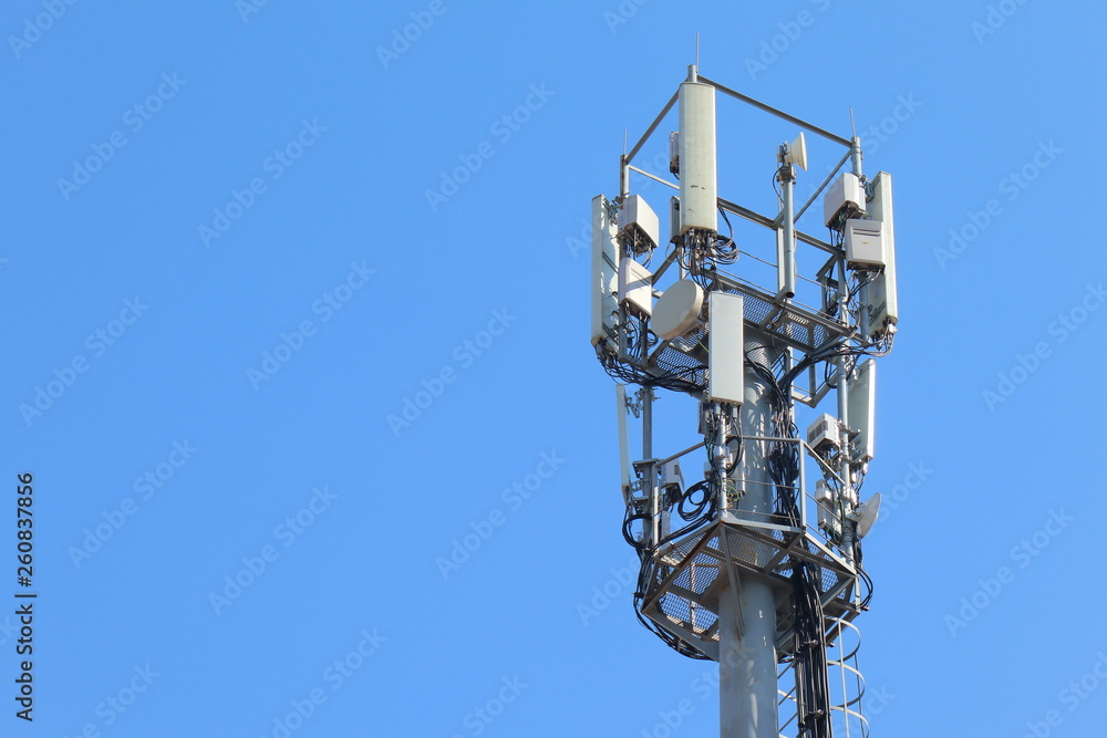 The cell tower in the blue sky