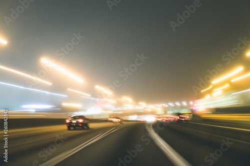 Fast night driving on highway, view from inside of a car