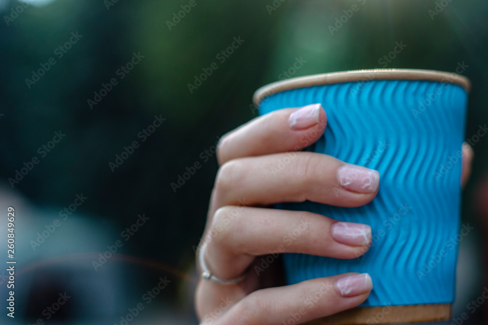 The sunshine that comes out of the blue coffee mug that holds in hand The sunshine that comes out of the blue coffee mug that holds in hand