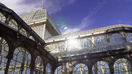 Madrid Parque de El Retiro Palacio de Cristal external panning shot. 1887 glasshouse Crystal Palace, made of glass in an iron framework with free entrance at Buen Retiro Park in the Spanish capital.
