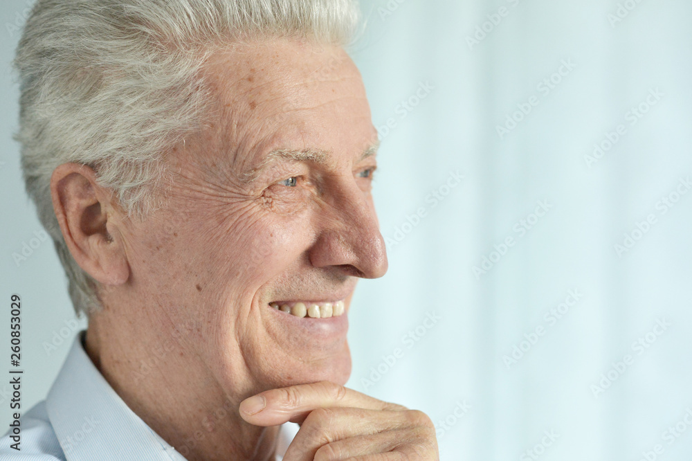 Close up portrait of smiling senior man posing Close up portrait of smiling senior man posing