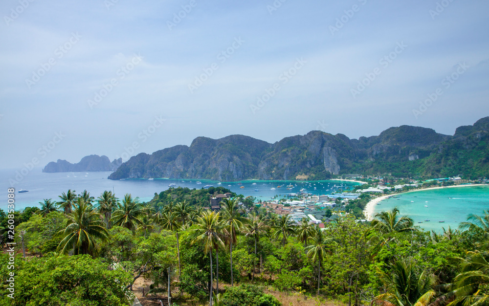 Beautiful view of the island with thin isthmus and two bays. Green mountains and tropic plants. Tropical island in the ocean, Phi-Phi island. Thailand.