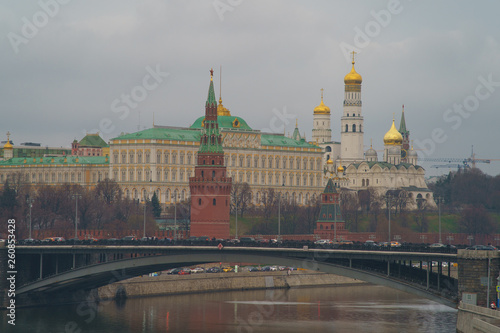 Image of historical Moscow Kremlin in the spring day. Kremlin Towers, Residence of the President of the Russian Federation, Ivan the Great Bell Tower and Bolshoy Kamenny Bridge over Moskva River.
