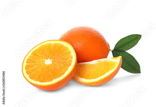 Fresh oranges with leaves isolated on white