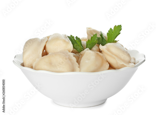 Bowl with tasty dumplings isolated on white