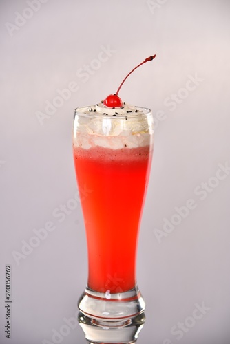 red cocktail with strawberry and mint isolated on white