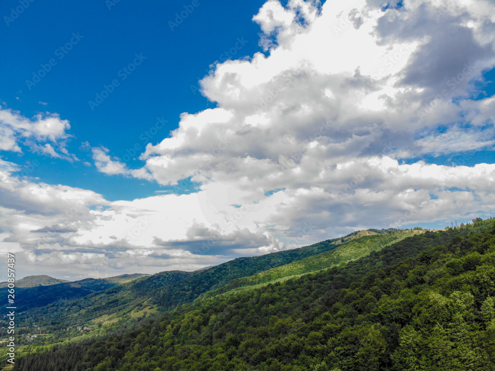 mountain hills and forest on the background of blue sky in the Carpathians, Ukraine mountain hills and forest on the background of blue sky in the Carpathians, Ukraine