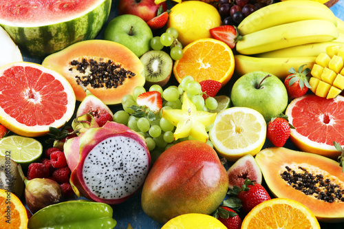 Tropical fruits background  many colorful ripe fresh tropical fruits