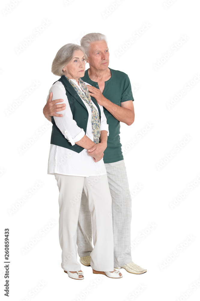 Full length portrait of senior couple embracing on white background Full length portrait of senior couple embracing on white background
