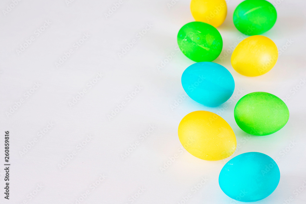 Easter eggs multicolored isolated on white background. Minimal easter concept. Happy easter card with copy space for text. Top view, flat.