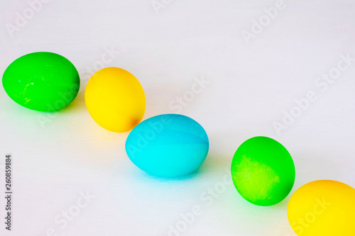 Easter eggs multicolored isolated on white background. Minimal easter concept. Happy easter card with copy space for text. Top view  flat.