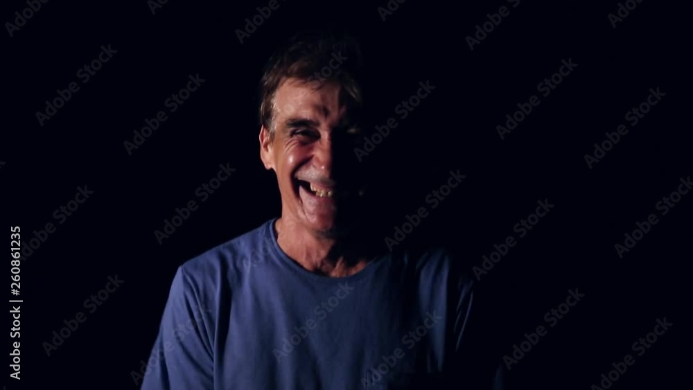 Older man with a sneaky laugh. Crazy man laughing Older man with a sneaky laugh. Crazy man laughing