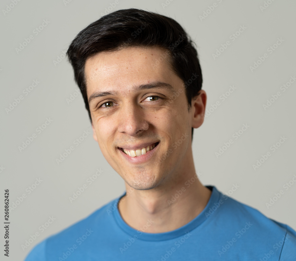 Portrait of young handsome man with happy and smiling face. Beauty concept and lifestyle Portrait of young handsome man with happy and smiling face. Beauty concept and lifestyle