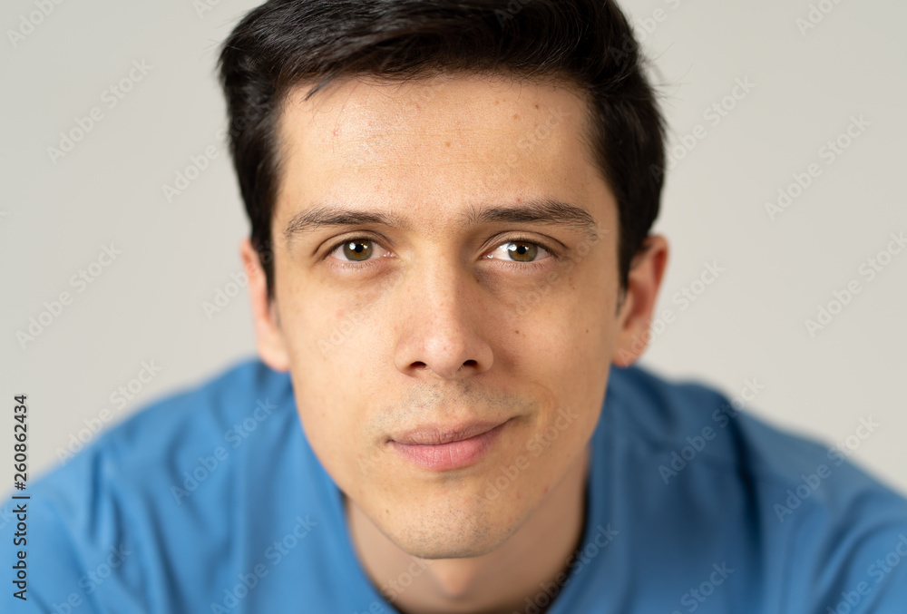 Portrait of young handsome man with happy and smiling face. Beauty concept and lifestyle Portrait of young handsome man with happy and smiling face. Beauty concept and lifestyle