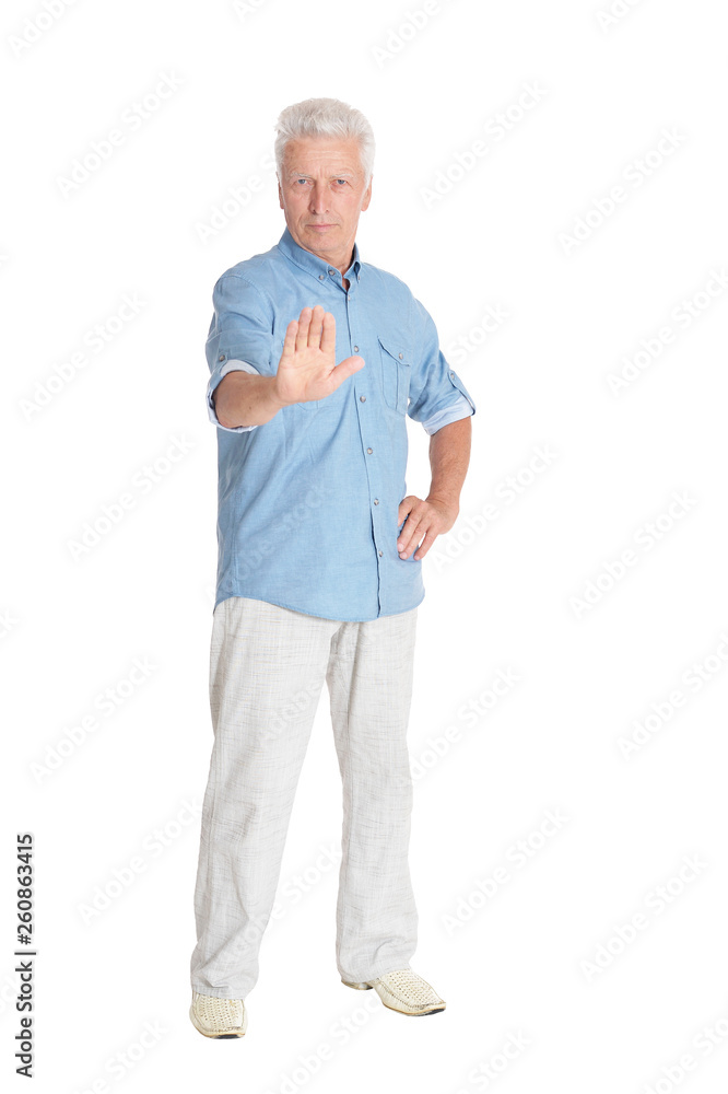 Portrait of senior man showing stop gesture isolated on white background Portrait of senior man showing stop gesture isolated on white background