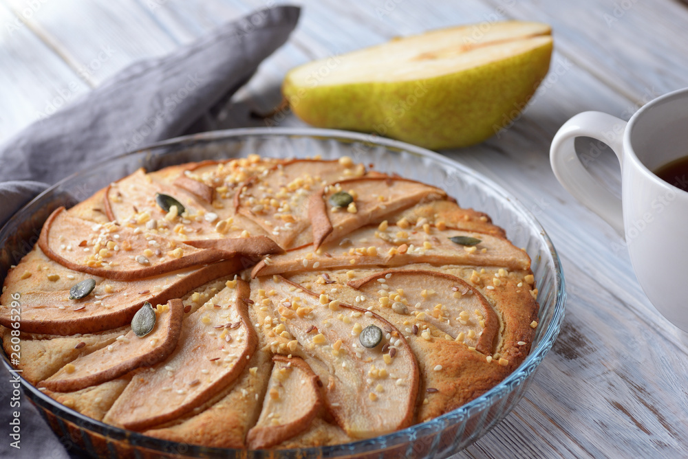 gorgeous pie with pears in a glass container on wooden background gorgeous pie with pears in a glass container on wooden background