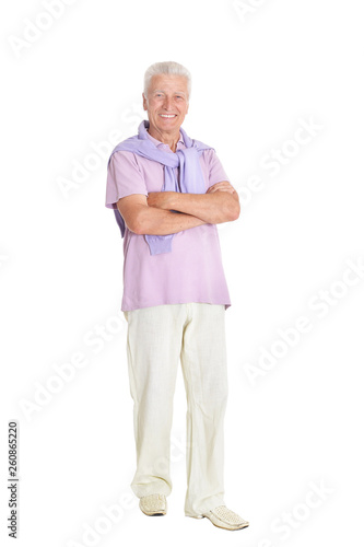 Portrait of happy senior man in purple shirt on white background