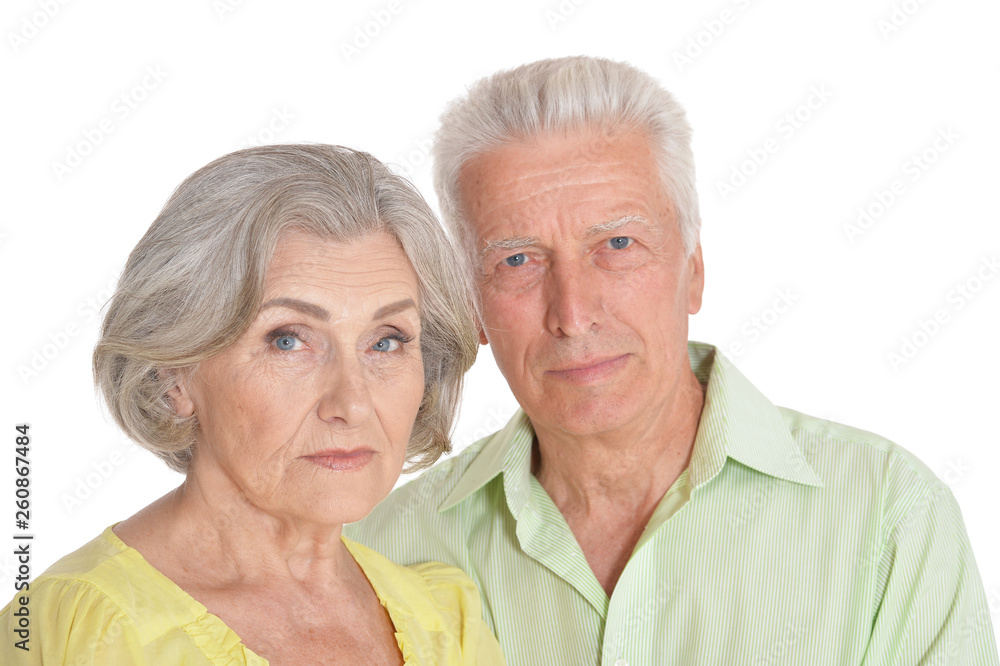 Close up portrait of sad senior couple on white background Close up portrait of sad senior couple on white background