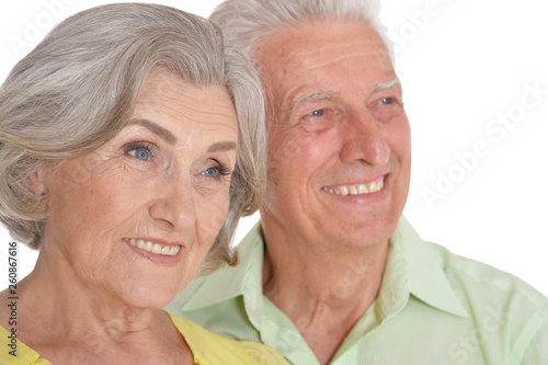 Portrait of happy senior couple posing on white background