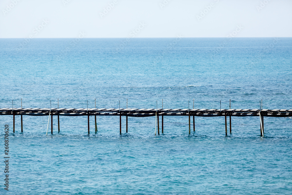 Pier stretching into the sea Pier stretching into the sea