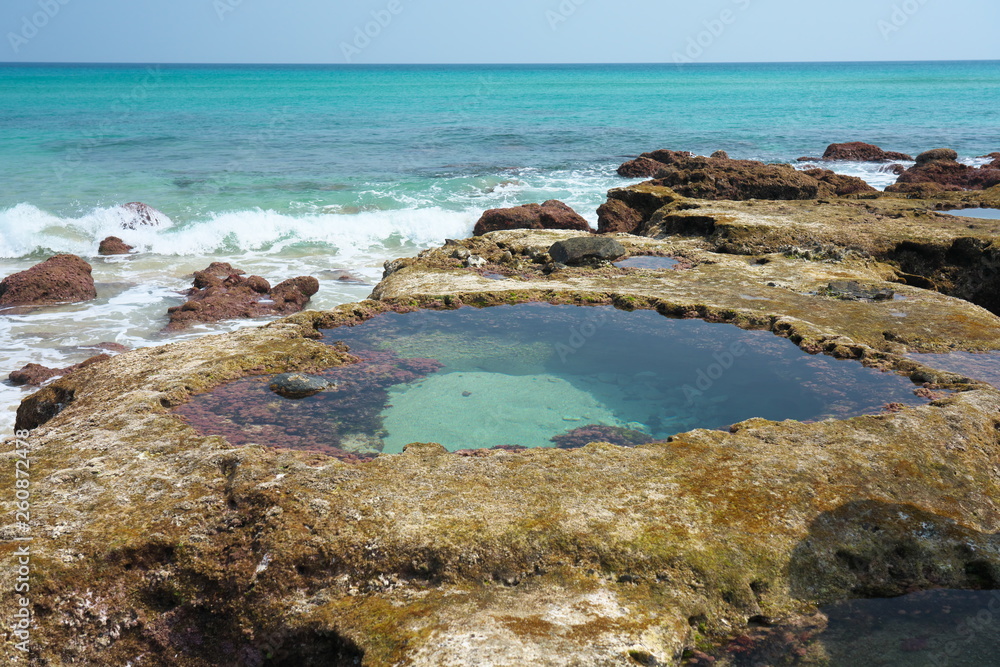 Heart-shaped tide pool at low tide at Akaogi district in Amami Oshima, Kagoshima, Japan Heart-shaped tide pool at low tide at Akaogi district in Amami Oshima, Kagoshima, Japan