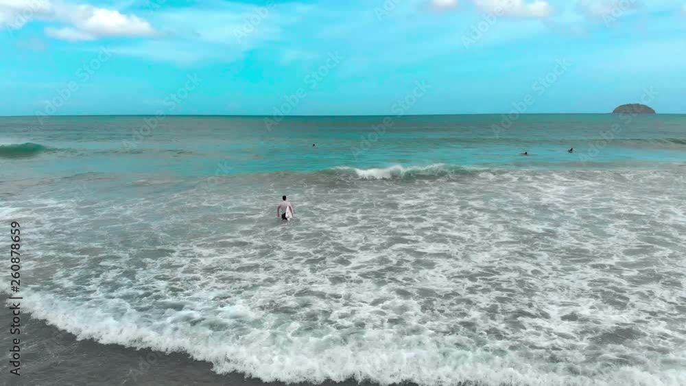 Surfer going into water Surfer going into water