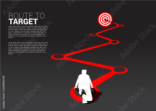 silhouette of businessman ready to run on route to dartboard. Business Concept of route to goal.