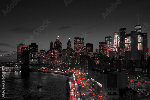 New York City black and white night skyline with red lights glowing in downtown Manhattan photo