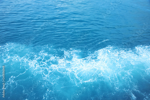 Sea Waves in ocean wave Splashing Ripple Water. Blue water background. 