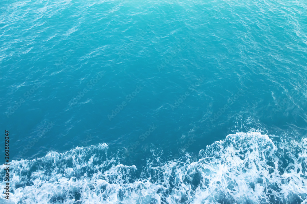 Sea Waves in ocean wave Splashing Ripple Water. Blue water background. Leave space to write descriptive text. Sea Waves in ocean wave Splashing Ripple Water. Blue water background. Leave space to write descriptive text.
