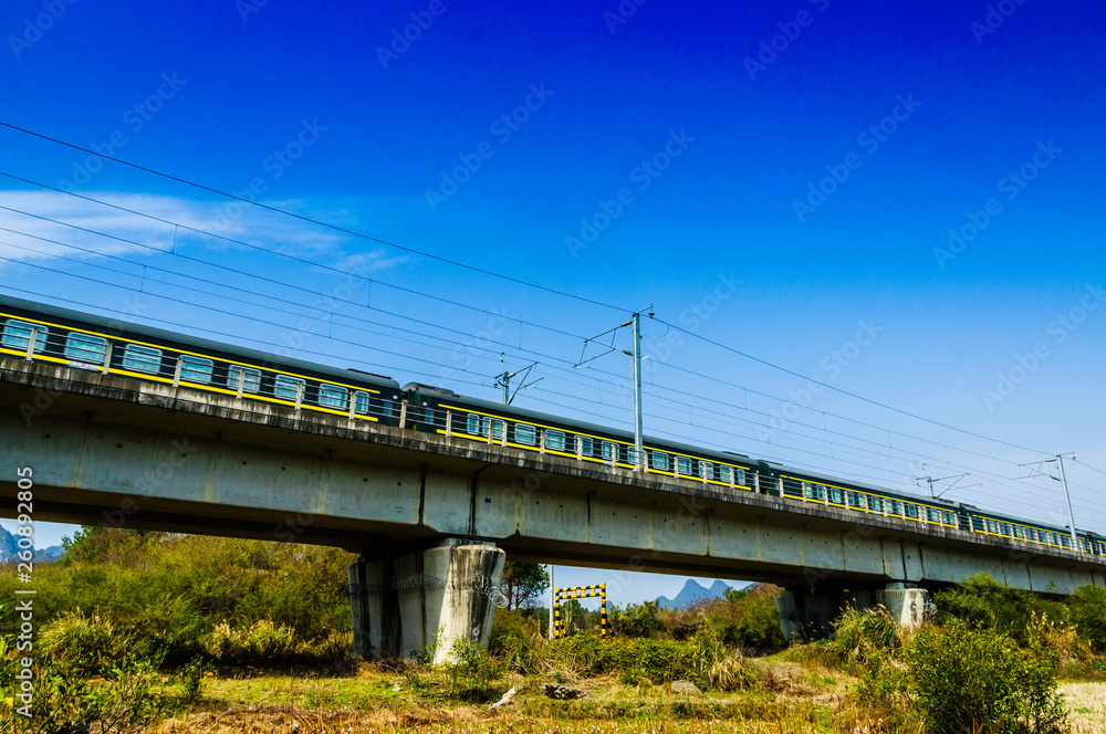 The train and bridge with blue sky background The train and bridge with blue sky background