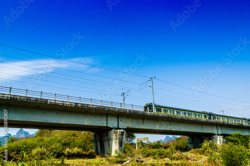 The train and bridge with blue sky background  © carl