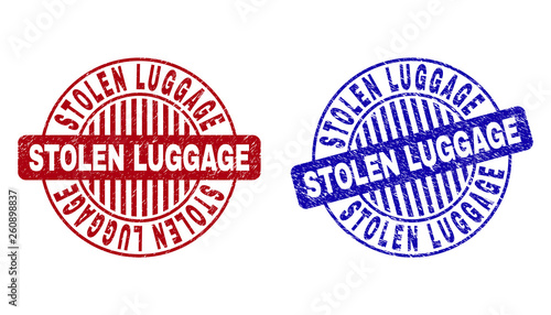 Grunge STOLEN LUGGAGE round stamp seals isolated on a white background. Round seals with grunge texture in red and blue colors.