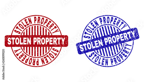 Grunge STOLEN PROPERTY round stamp seals isolated on a white background. Round seals with grunge texture in red and blue colors.