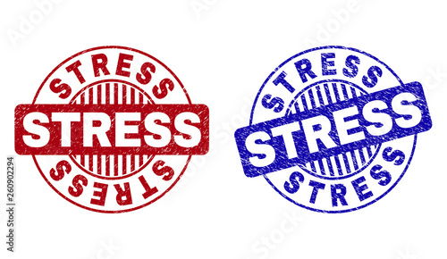 Grunge STRESS round stamp seals isolated on a white background. Round seals with grunge texture in red and blue colors. Vector rubber overlay of STRESS caption inside circle form with stripes.